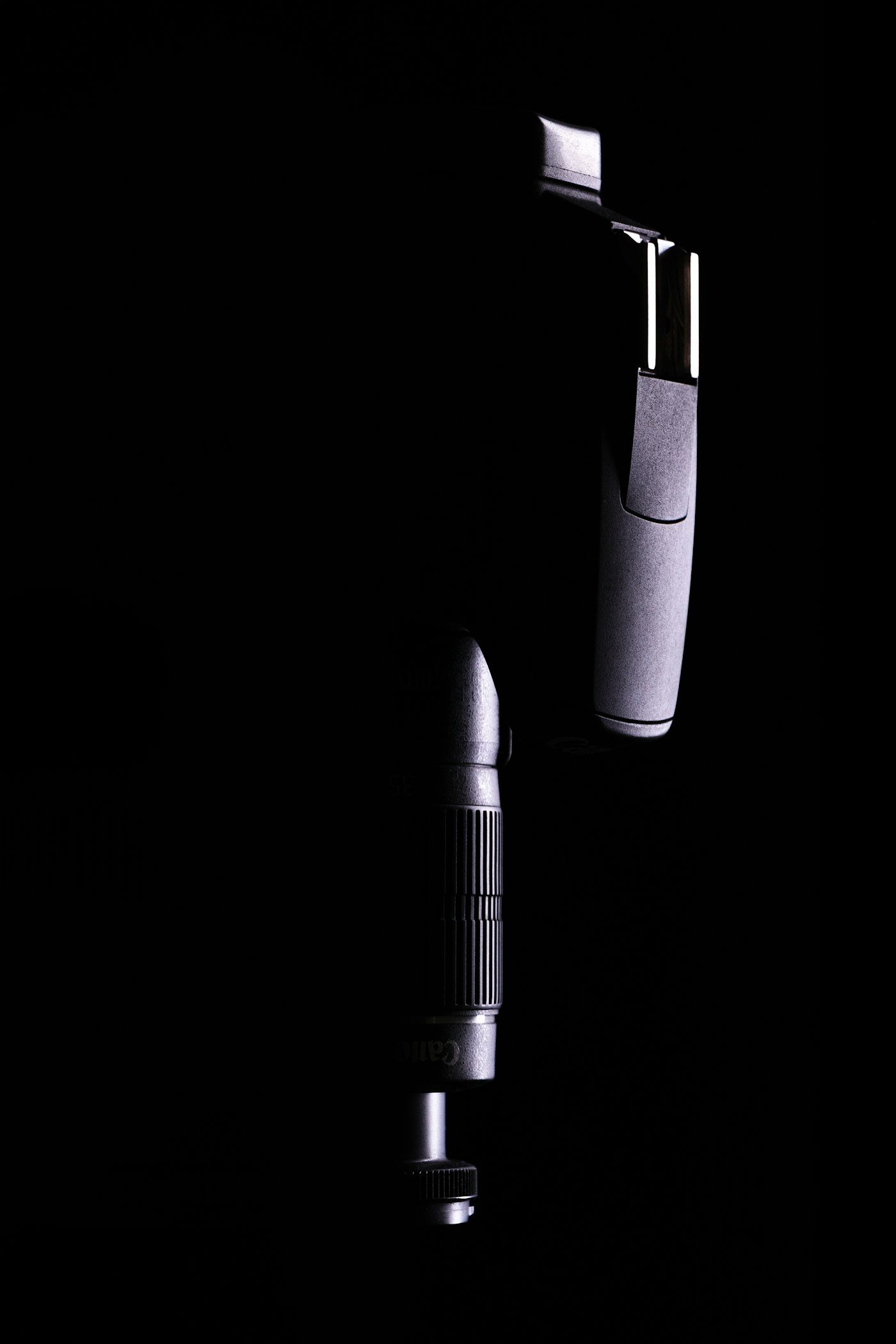 Two precision handpieces on a dark ground