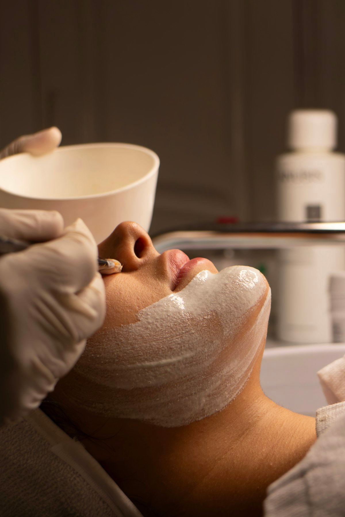 Close-up of a facial mask being applied